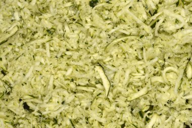 Ayrıntılı, tam kare rendelenmiş kabak portresi. Dokusunu ve açık yeşil rengini gösteriyor.