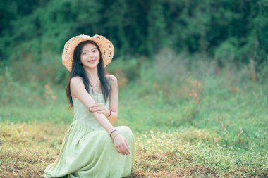 Relaxed brunette girl walking on rice fields