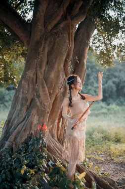 Nostaljik tema, ağacın altında flüt çalan kız.