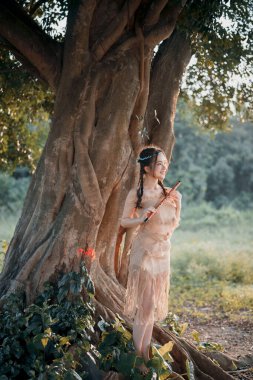 Nostaljik tema, ağacın altında flüt çalan kız.