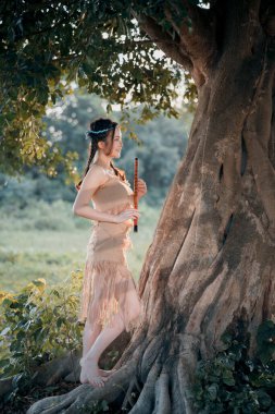 Nostaljik tema, ağacın altında flüt çalan kız.