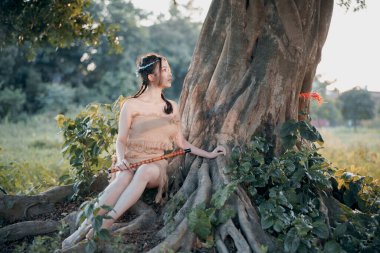 Nostaljik tema, ağacın altında flüt çalan kız.