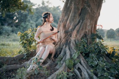 Nostaljik tema, ağacın altında flüt çalan kız.