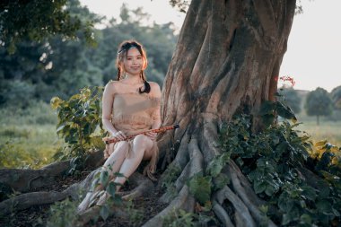 Nostaljik tema, ağacın altında flüt çalan kız.