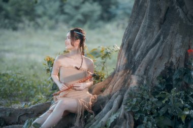 Nostaljik tema, ağacın altında flüt çalan kız.