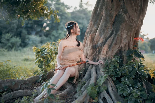 Nostaljik tema, ağacın altında flüt çalan kız.