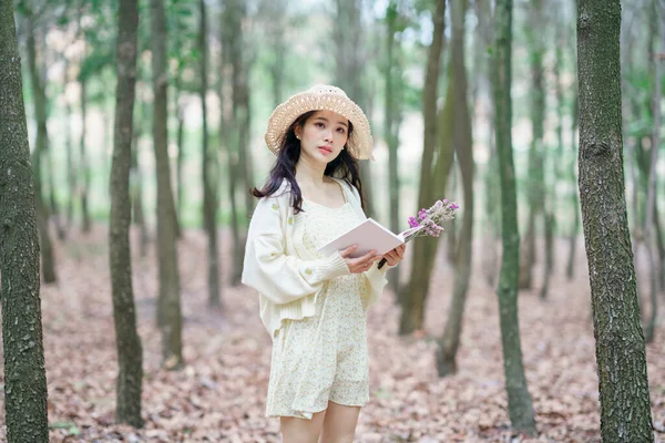 stock image The girl reads in the woods