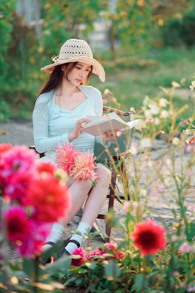 Young Girls Read Books Garden Stock Picture