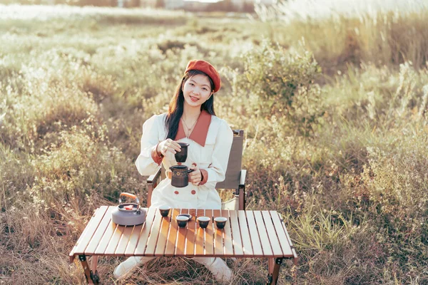Asian girls make tea in the suburbs