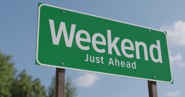 Driving Pan Weekend Just Ahead Green Road Sign — Stok Video