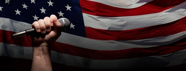 Male Fist Gripping Microphone Waving American Flag Background Banner — Stock Photo, Image