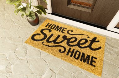 Home Sweet Home doormat on the porch at the front door. clipart