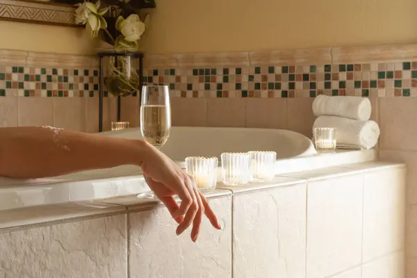 Woman Relaxing Bathroom Spa Tub Glass Sparkling Champagne Candles — Stock Photo, Image