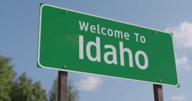 Mavi Gök ve Bulutlara Karşı Idaho Yeşil Yol Tabelasına Hoş Geldiniz.
