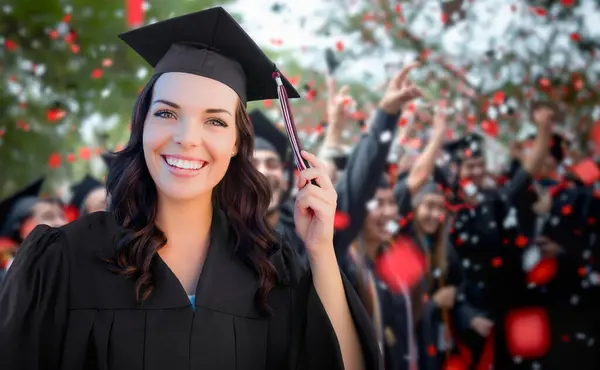 stock image Young Female Graduate Celebrating Her Graduation with Her Fellow Classmates Outdoors.