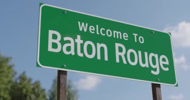 Baton Rouge, Louisiana 'ya Hoş Geldiniz Mavi Gök ve Bulutlara Karşı Yeşil Yol İşareti.