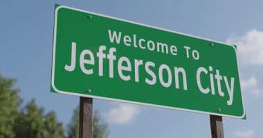 Jefferson City, Missouri 'ye Hoş Geldiniz Mavi Gök ve Bulutlara Karşı Yeşil Yol İşareti.