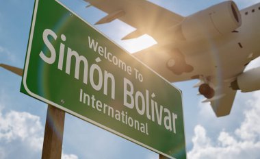 Simon Bolivar Uluslararası Havalimanı Yeşil Yol İşareti 'ne hoş geldiniz. Alçaktan Uçan Uçak İniş Aracı İniş Aracı' nın hemen üstünde..