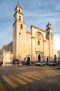 MERIDA,MEXICO - AUGUST 3,2002 : Street scene at sunset in Merida with a view of the Cathedral