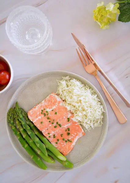 stock image Fresh caught Pacific Ocean coho salmon filet in flat lay composition with asparagus and rice.  Healthy source of Omega 3.  