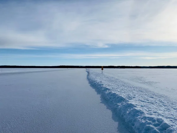 Winter landscape of frozen lake in north Sweden
