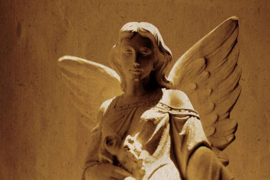 Detail of angel carved in stone statue for religious worship heaven spirituality old weathered paper texture clipart