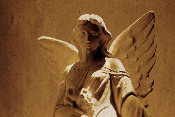 Detail of angel carved in stone statue for religious worship heaven spirituality old weathered paper texture
