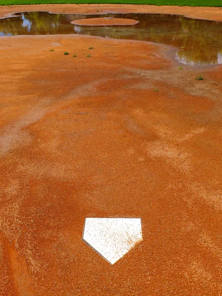 Flooded baseball diamond base ball field from rain or flooding