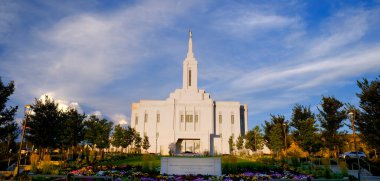 Pocatello Idaho LDS Mormon Latter-day Saint Temple with sky clouds flowers and trees