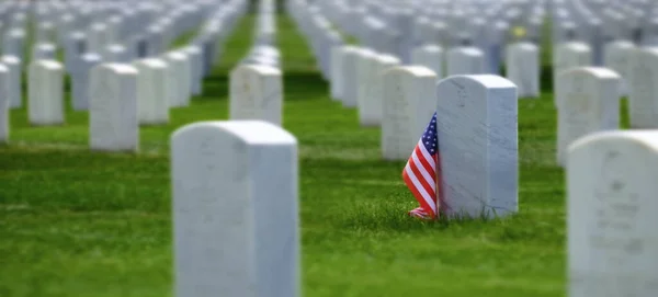 Military cemetery in the United States with headstones for soldiers white marble rows