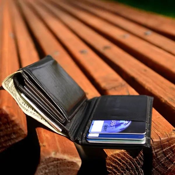 Lost wallet left on bench by owner with cash and credit cards