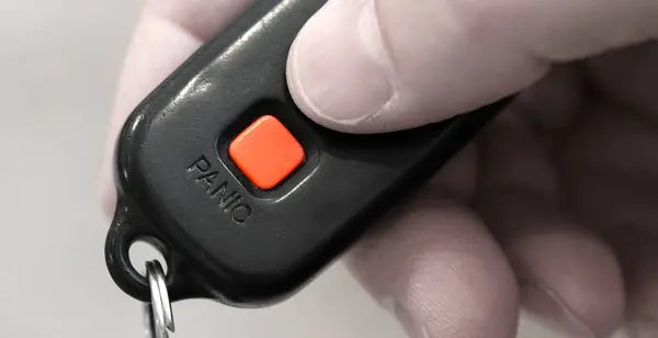 Closeup of Panic Button on key fob for car safety system on keys