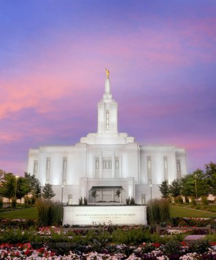 Pocatello Idaho LDS Mormon Latter Day Saint Temple at sunset with glowing lights and trees clipart