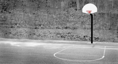 Detail of urban basketball hoop inner city innercity wall and asphalt in outdoor park clipart