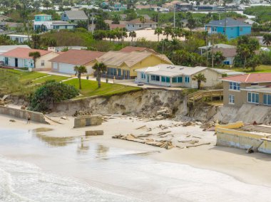 Beach homes collapse aftermath Hurricane Nicole Daytona Florida clipart