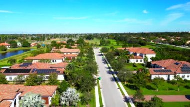Aerial video luxury Florida homes with solar power roofs