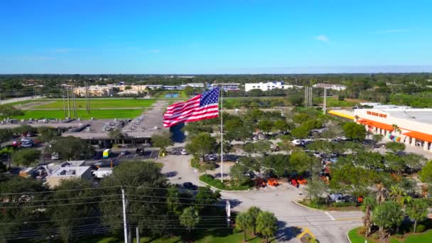 Aerial Flyover American Flag Flailing Wind — Stockvideo