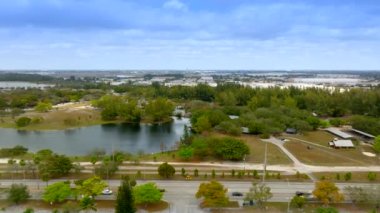 Aerial lateral side view of Amelia Earhart park and Miami Opa Locka Executive Airport Hialeah Florida