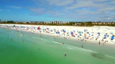 Sarasota Beach Siesta Key full of tourists and locals enjoying the warm winter weather