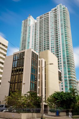 Old and new buildings MIami Brickell on blue sky