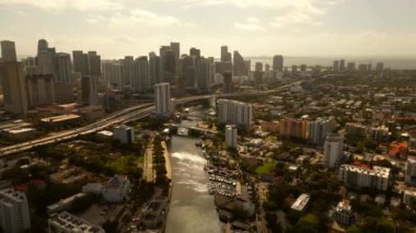 Miami aerial stock 2023. Amazing drone footage of Brickell and Miami River. Moody warm hue