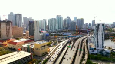 Bright aerial drone video Downtown Miami. Highways passing Brickell 4k