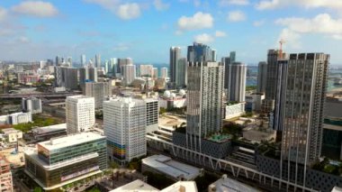 Aerial stock video Downtown Miami skyscrapers. Drone flying past city on nice vibrant day