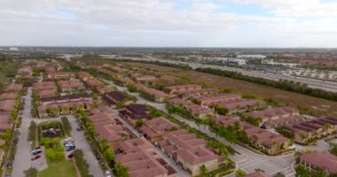 5k drone video residential housing Pembroke Pines Miramar Florida. Community of townhomes near expressway
