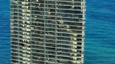 Aerial closeup Residences by Armani Casa Sunny Isles Beach condominium balconies with ocean in background