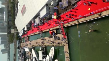 Static vertical aerial drone footage of the Miami International Boat Show for social media content