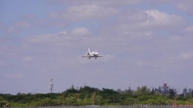 Private jet landing at FLL. 8k tracking motion video