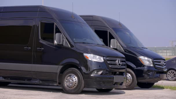 Two Black Mercedes Sprinter Limo Vans Parked — Stockvideo