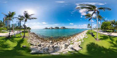 Miami Beach, FL, USA - September 3, 2023: Beautiful scene Miami Beach South Pointe Park looking at Fisher Island clipart