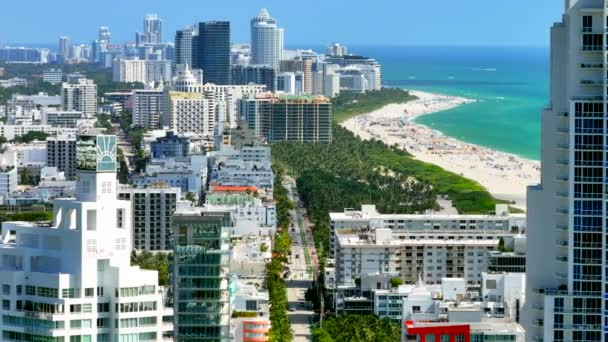 Aerial narrow view of Miami Beach Ocean Drive between highrise condominium buildings 2023